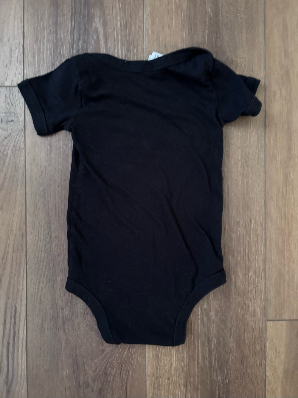 Bella Canvas Black Baby One-Piece with Yellow Smiley and White Graphic - Picture 2 of 3